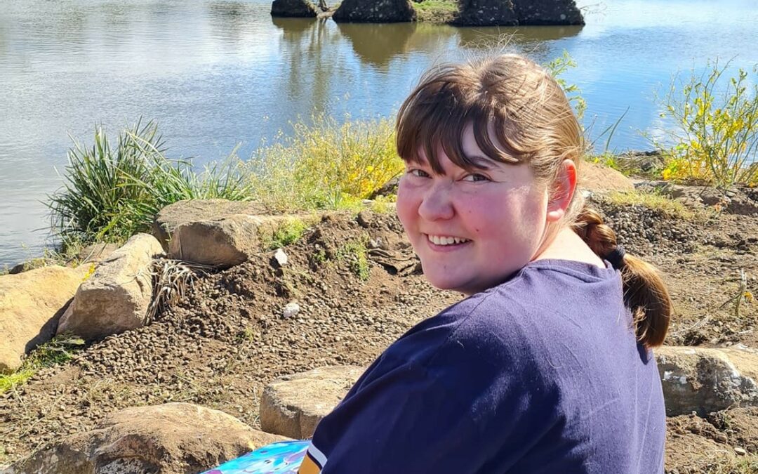 Kathryn sitting by Cherrywood Pond