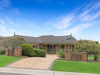 Large SIL house with wide driveway and garage.