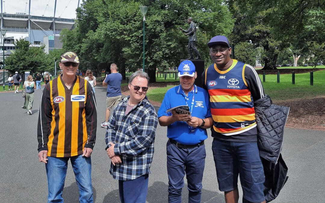 Footy fans cheer on The Hawthorn Hawks