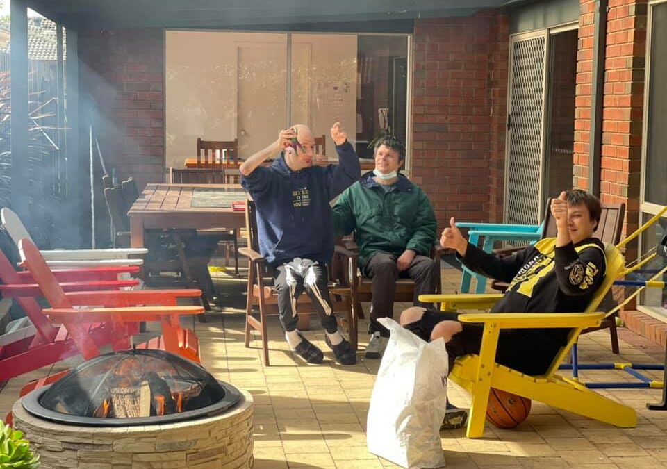 Jesse, Michael and Jackson sitting outside with the firepit