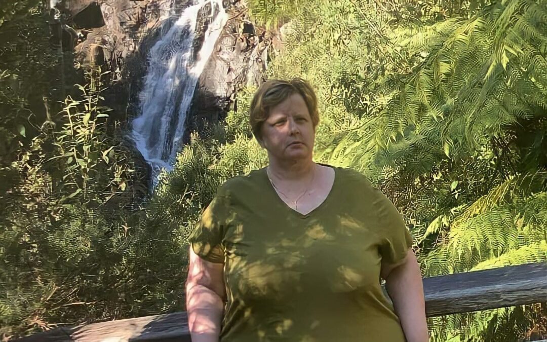 Our client jodie posing in front of the waterfall at Steavensons Falls