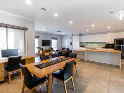 Open plan dining room, living room and accessible kitchen.