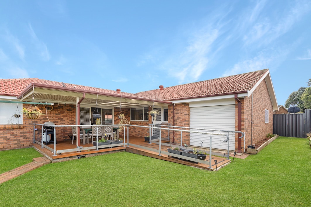 Large backyard with a garden and outdoor entertainment area