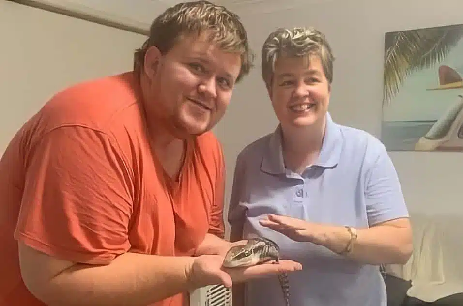 Ben and Ange with a reptile