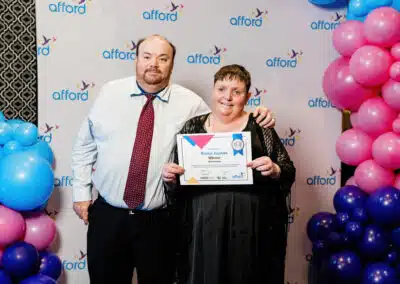 Afford scholarship winner Roslyn poses with her brother