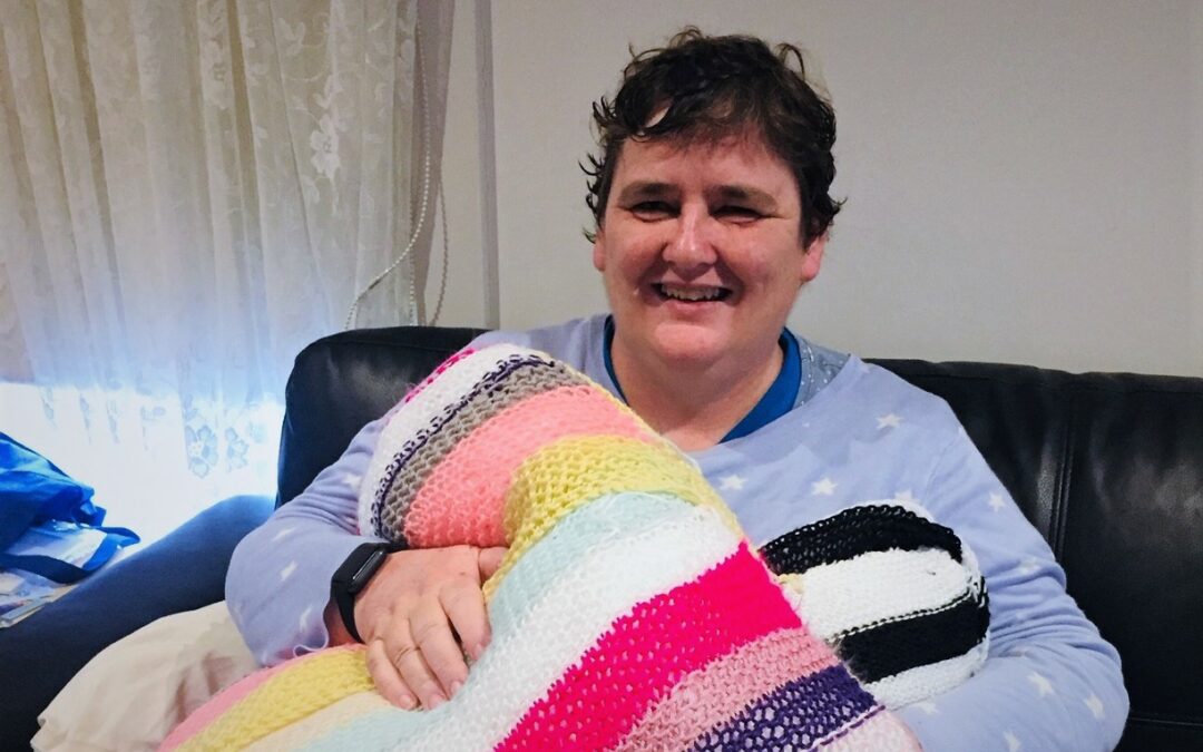 Tracey with the cushions she has been knitting