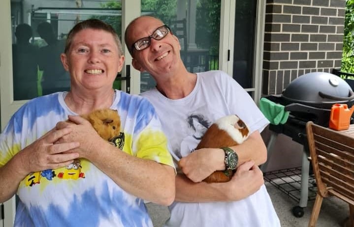 Jean and Stephen with their new pet guinea pig.