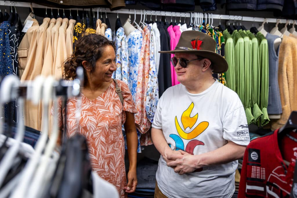 Male client out shopping in the community with their support worker