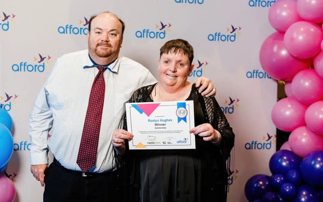 Scholarship winner, Roslyn poses with her brother at Afford employee awards event