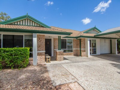 Brick SIL house in Waterford with a large driveway and garage.