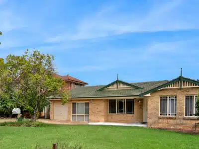 Large SIL house with wide driveway, garage and spacious frontyard