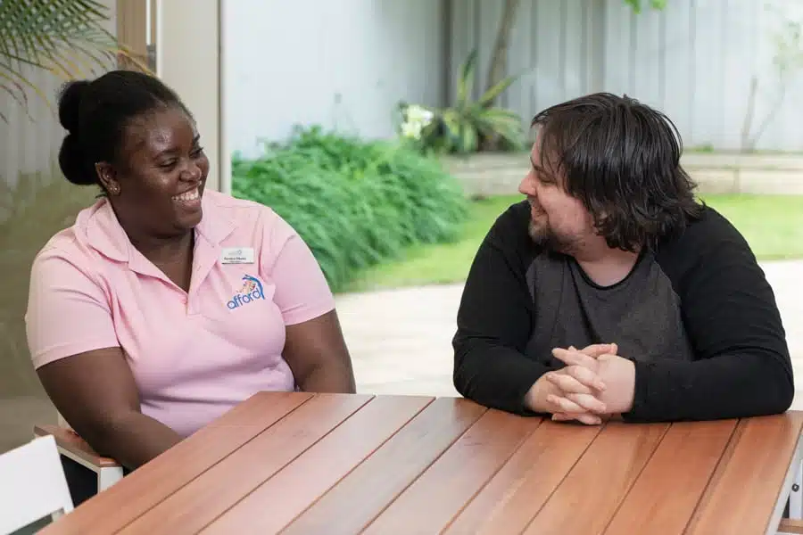 Team leader having a happy chat with her SIL client