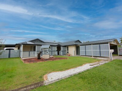 Large SIL house in Deception Bay with a grassed front garden and wishing well.