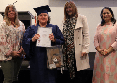 Supported employee Linda Romig presented with qualification