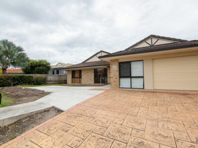 Large SIL house in Deception Bay with ramp access, a large garage and grassed front garden.