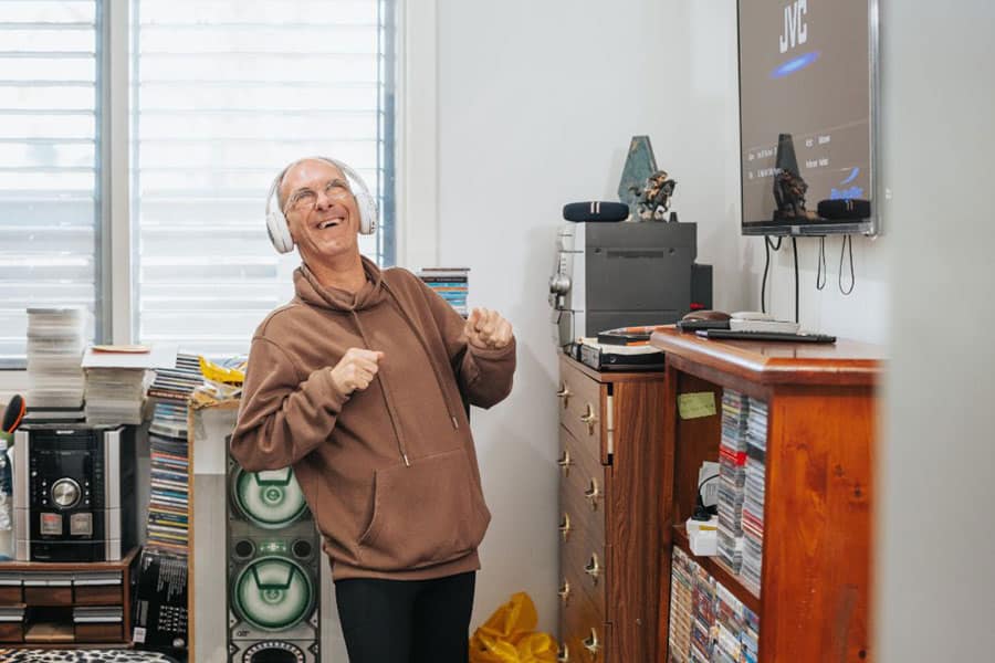 a man wearing headphones and dancing