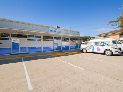 Afford Community Hub in Redland Bay with buses in the car park.
