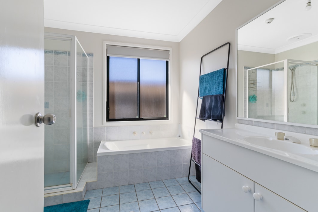 Bathroom with sink, shower and bathtub.